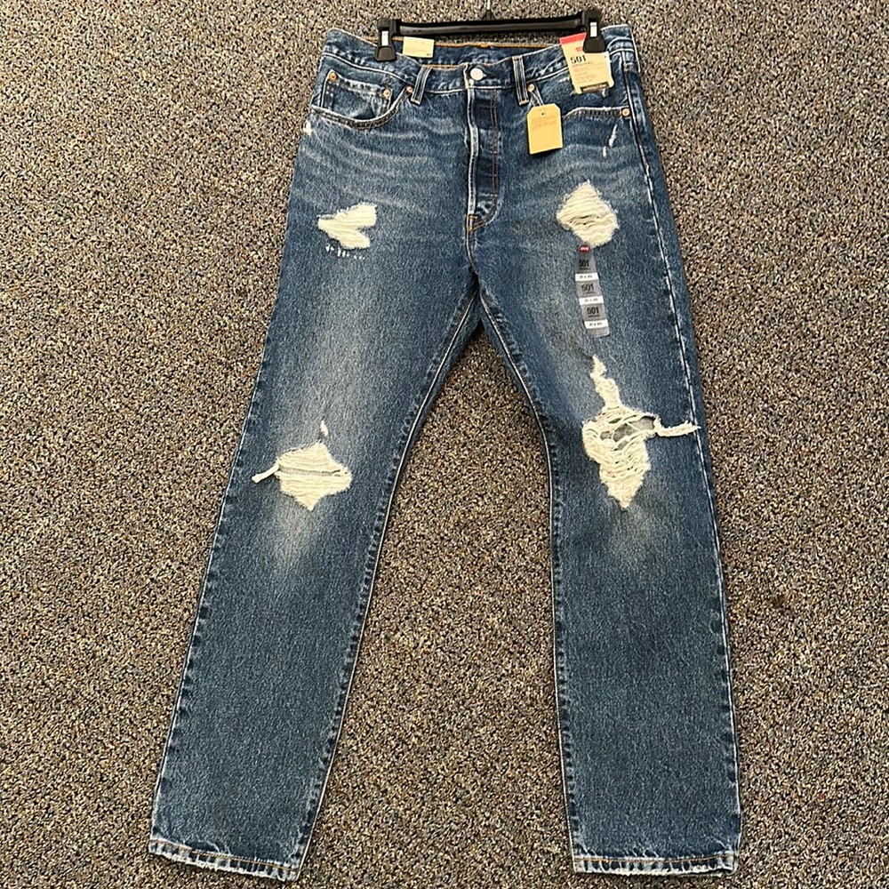 Levi denim New with tags. Size 30 distressed dark wash.